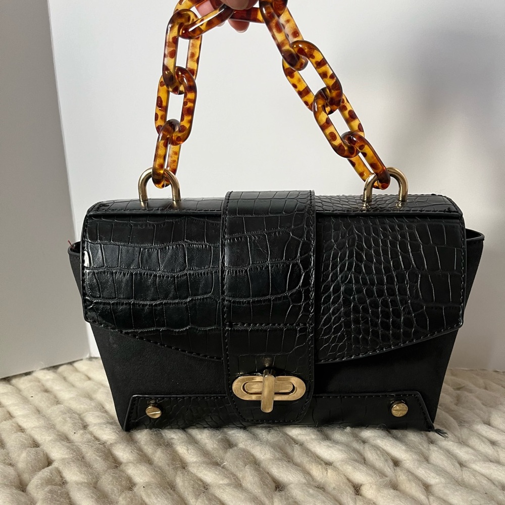 BLACK CLUTCH W/ HARDWARE DETAIL